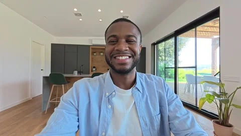 Happy Young Black Man Smiling at Camera During a Video Call at Home 스톡 동영상 333539655