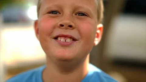Happy young boy breaking into laughter. Видео 88405818