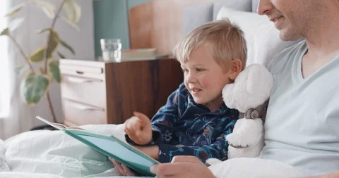 Happy young boy having fun reading Stock Footage 120362263