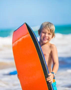 Happy young boy having fun at the beach on vacation, Stock Photos