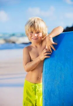 Happy young boy having fun at the beach on vacation, Stock Photos