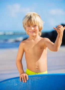 Happy young boy having fun at the beach on vacation, Stock Photos