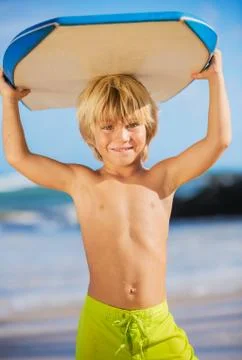 Happy young boy having fun at the beach on vacation, Stock Photos