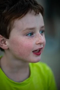 Happy young boy having fun on boardwalk amusement ride Stock Photos