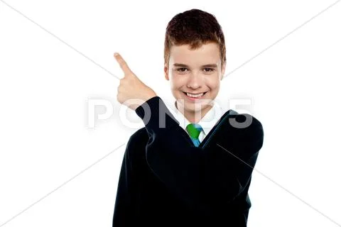 Happy young boy indicating upwards Stock Photos