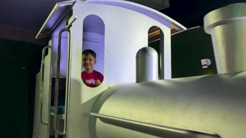 Happy Young Boy Inside Miniature Train Engine At Indoor Family Entertainment Stock Footage 340958500