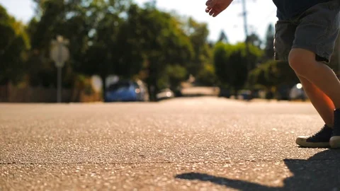 Happy young boy playing on the steps outside a house. 스톡 동영상 88405441