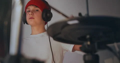 Happy young boy practice playing electronic instrument drums at musical studio Stock-Footage 140475009