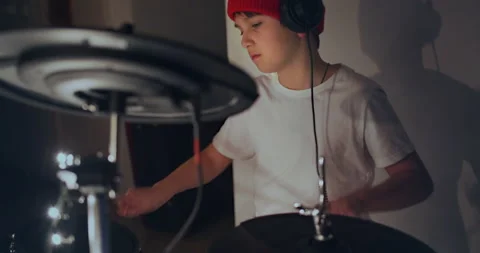 Happy young boy practice playing electronic instrument drums at musical studio Stock-Footage 140475056