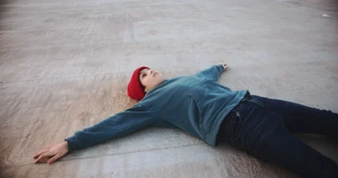 Happy young boy on rooftop at sunset wearing hoody and beanie red hat looking to Stock-Footage 139579272