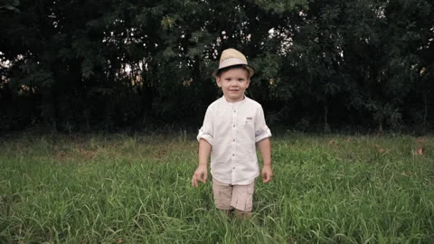 Happy young boy runs to the camera and rejoices Video stock 140844734