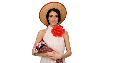 Happy young bride in straw hat and white dress with red flower waving hi, alpha Stock Footage 114432861