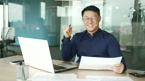 Happy young businessman IT programmer with glasses reading mail work letter with Stock Footage 225763005