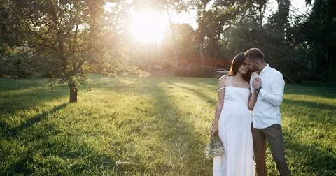 Happy Young Couple Expecting Baby. Beautiful Pregnant Woman and Her Husband Stock Footage