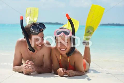 Happy young couple have fun on beach Stock Photos
