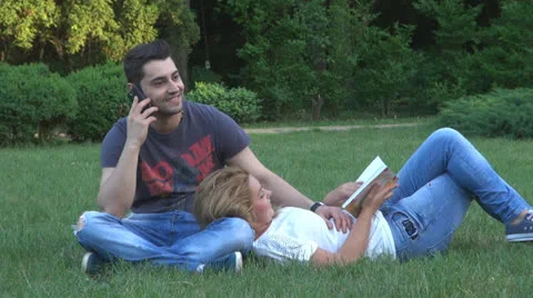 Happy young couple is having fun in the park Stock Footage 23907396