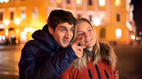 Happy young couple having fun in the night city Video stock 60412510