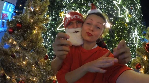Happy Young Couple Having Fun At Merry Christmas Party Видео 92695857