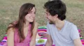 a happy young couple laughing at the camera,in the park HD Footage