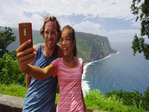 Happy young couple in love having fun taking selfie with phone Stock Footage