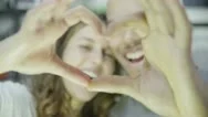 Happy Young Couple Make A Heart Shape With Their Hands Stock Footage