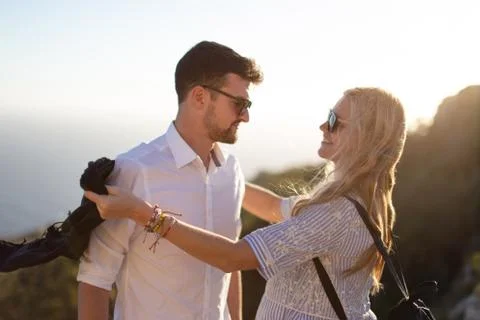 Happy young couple smiling in sunset together Stock Photos