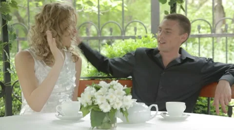 Happy young couple spending time at marvelous summer cafe Stock-Footage 7766916