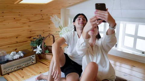 Happy Young Couple Taking Selfie on Living Room, Capturing Their Joyful Rel.. Stock Footage 252278950