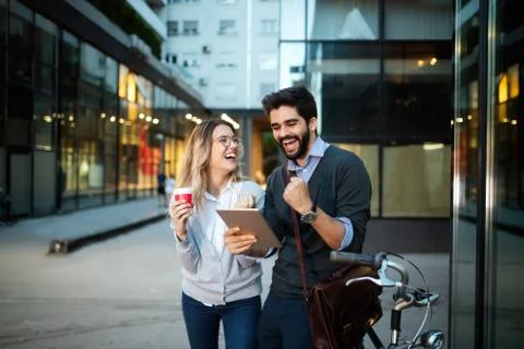 Happy young couple using a digital tablet together and smiling Stock Photos