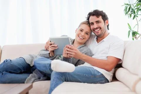 Happy young couple using a tablet computer 스톡 사진