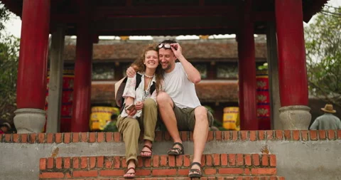 Happy young couple on vacation taking a selfie together at an ancient Asian Stock Footage 338011009