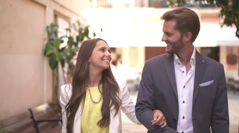 Happy young couple walking through old town Stock Footage 62700665