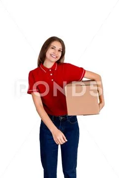 Happy young delivery girl in a red T-shirt is holding a carton parcel box und Stock Photos