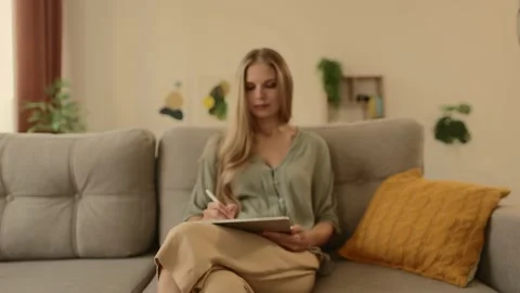 Happy young designer drawing on a graphics tablet with a stylus pen. Stock-Footage 224542300