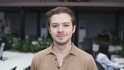 Happy Young Employee Looking at Camera and Smiling Stock Footage 106353154