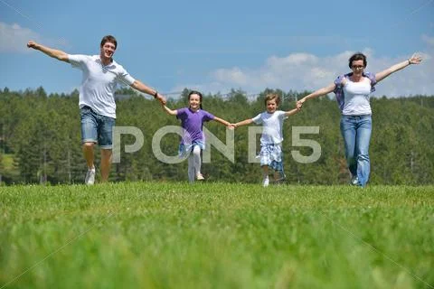 Happy young family have fun outdoors Stock Photos