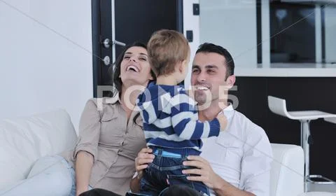 Happy young family have fun at home Stock Photos