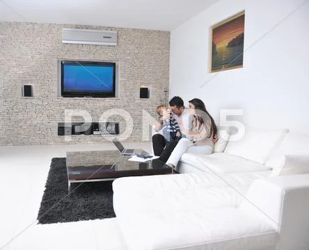 Happy young family have fun at home Stock Photos