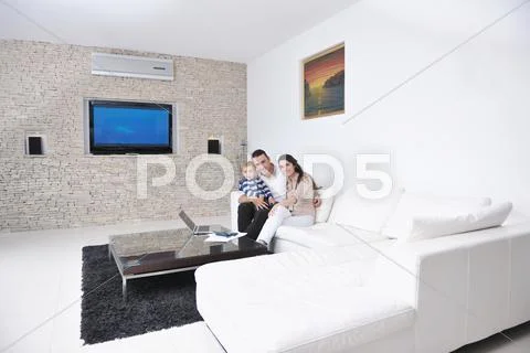 Happy young family have fun at home Stock Photos
