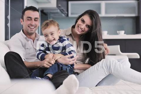 Happy young family have fun at home Stock Photos