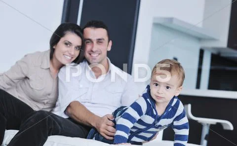 Happy young family have fun at home Stock Photos