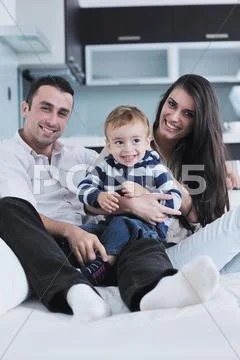 Happy young family have fun at home Stock Photos