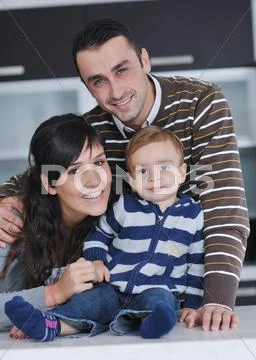 Happy young family have fun at home Stock Photos