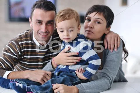 Happy young family have fun at home Stock Photos