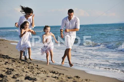 Happy young family have fun on beach Stock-Fotos