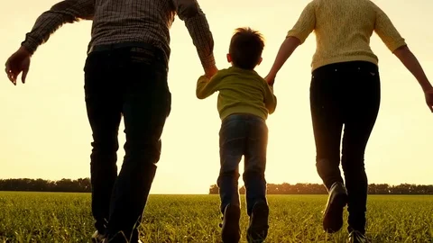 Happy Young Family with one children running on summer field. Healthy mother Stock Footage