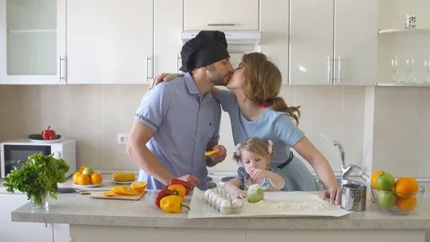 Happy Young Family Spending Time in The Kitchen Stock Footage