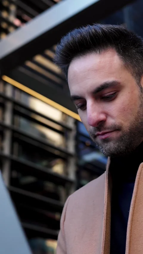 Happy young freelancer man working on laptop sitting outdoors. Stock Footage 247052031
