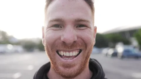 Happy young ginger man looking at camera. Closeup portrait of smiling male   Stock Footage 263487631