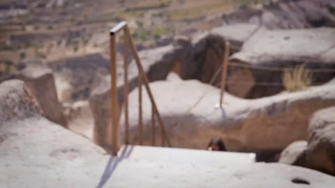 The Happy young girl is climbing upstairs to tarmac. She is visiting Cappadocia Stock Footage